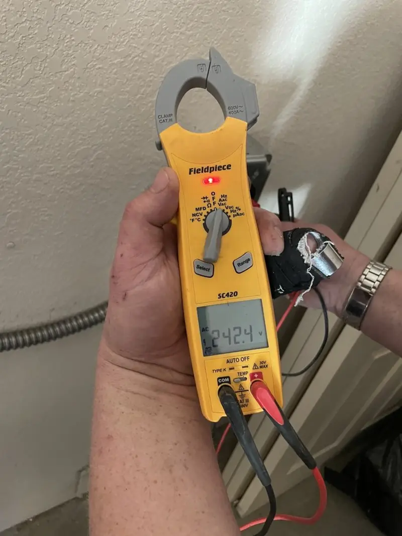 Voltage testing with clamp meter during Circuit Breaker Repair in Fairmont
